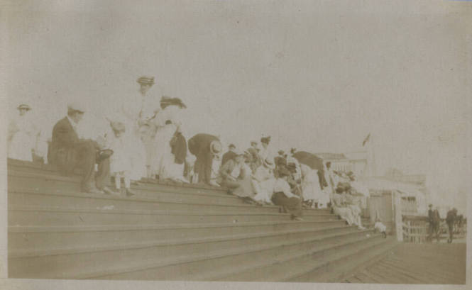Untitled [Crowd sits on steps]