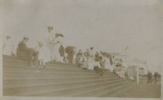 Untitled [Crowd sits on steps]