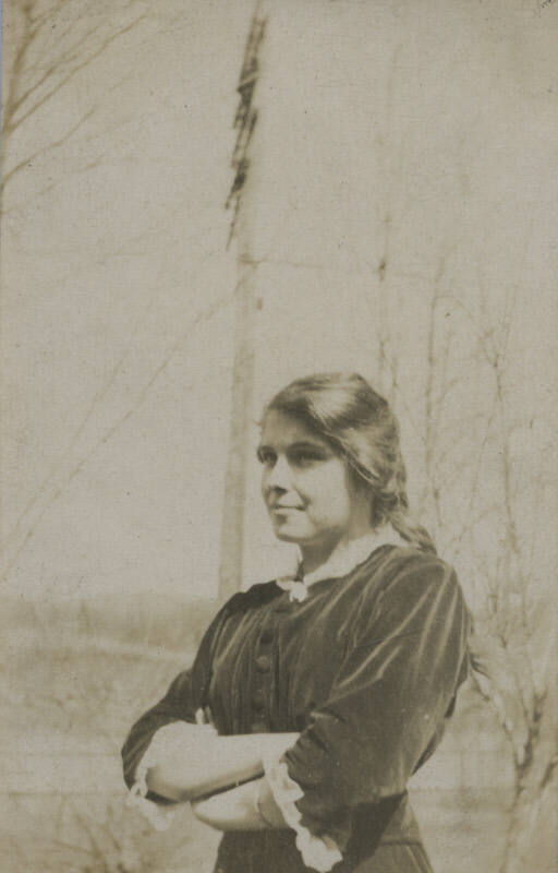 Untitled [Woman crosses arms across chest]