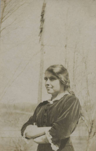 Untitled [Woman crosses arms across chest]