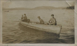 Untitled [Four men sit on a boat]