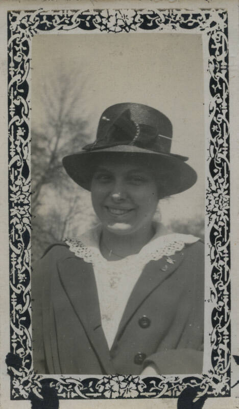 Untitled [Woman wears hat and embroidered collar shirt]