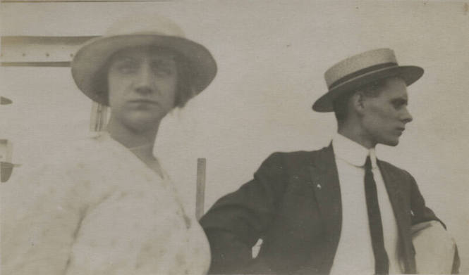 Untitled [Woman and man, man looks away]
