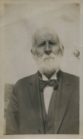 Untitled [Man wears suit and bowtie]