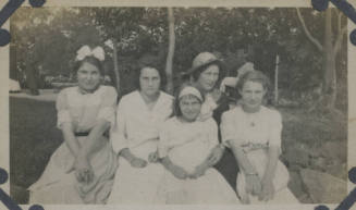 Untitled [Five women sit on lawn]