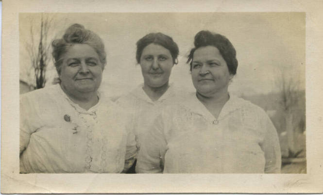 Untitled [Three women stand outside]