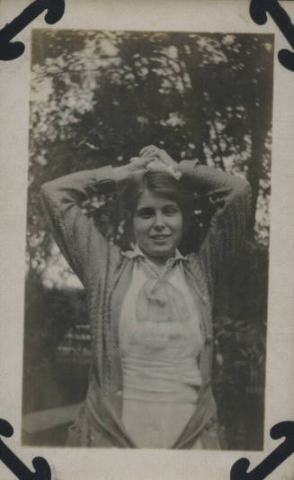 Untitled [Woman holds hands above head]