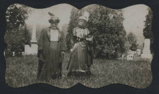 Untitled [Two women stand in cemetary]