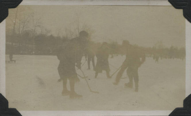 Untitled [People play hockey]
