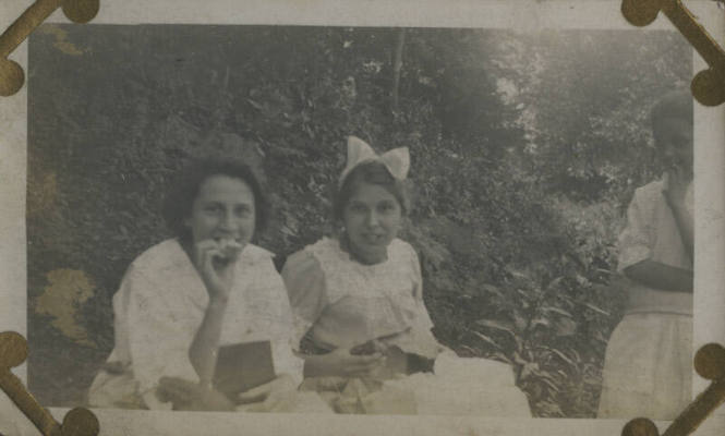 Untitled [Two women sit in garden]