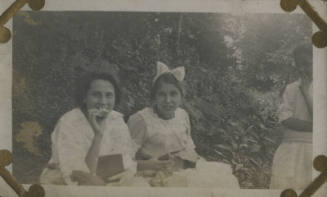 Untitled [Two women sit in garden]