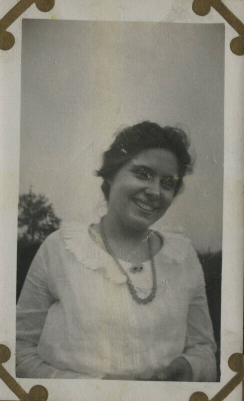 Untitled [Woman stands on field]
