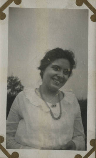 Untitled [Woman stands on field]
