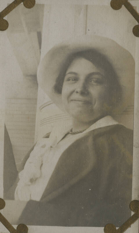 Untitled [Woman wears hat]