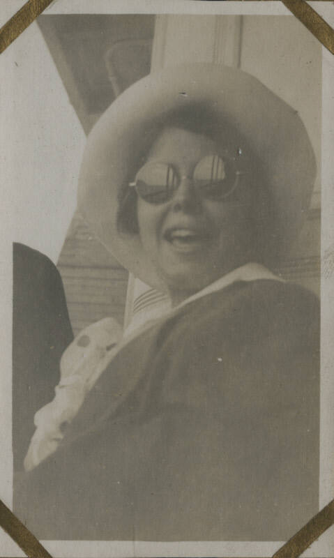 Untitled [Woman wears hat and sunglasses]