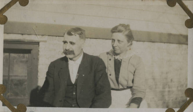 Untitled [Woman and man sit]
