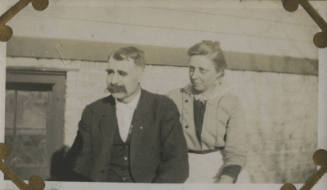 Untitled [Woman and man sit]