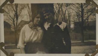 Untitled [Woman and man stand in front of trees, arms around each other's shoulders (#127 duplicate)]