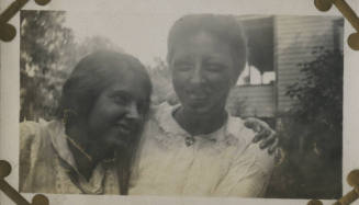 Untitled [Two women smile, arms around each other]