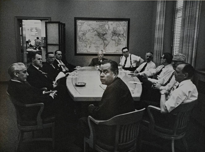 New York Times—Men around Conference Table