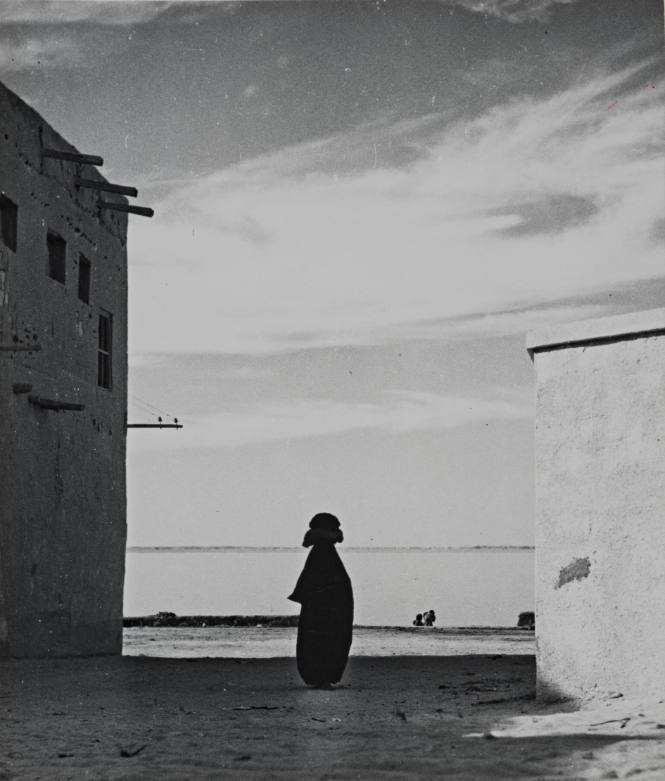 Silhouette of Figure between Two Buildings, Kuwait