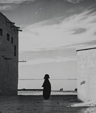 Silhouette of Figure between Two Buildings, Kuwait