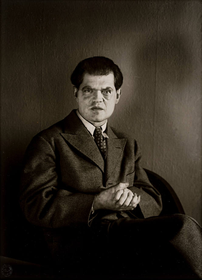 The Dadaist Raoul Hausmann, sitting