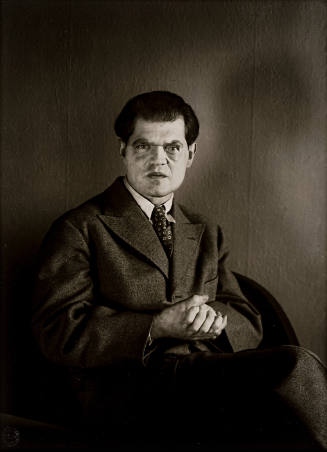 The Dadaist Raoul Hausmann, sitting