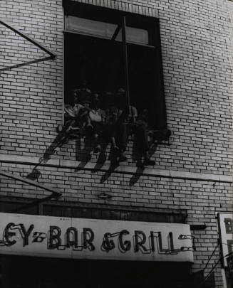 Watching a Parade form a Harlem Window
