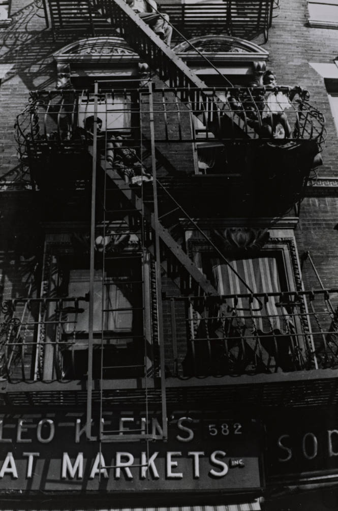Harlem Tenement Dwellers Watching a Parade