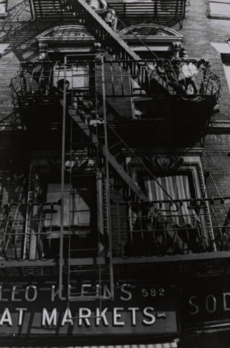 Harlem Tenement Dwellers Watching a Parade