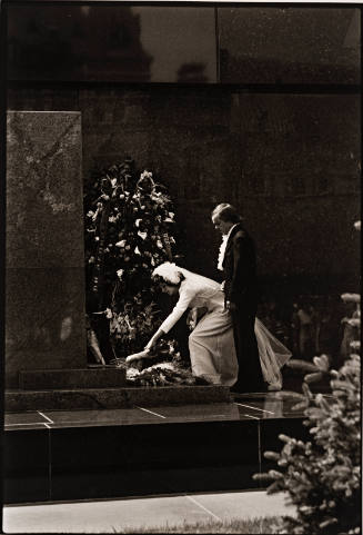USSR (wedding couple placing flowers at grave)