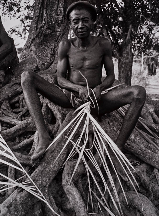 Nigeria (Man with dried palm frond),