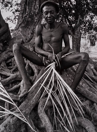 Nigeria (Man with dried palm frond),