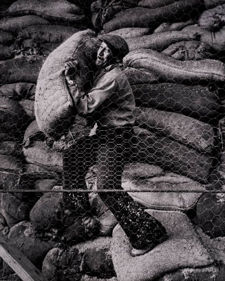 1961, Colombia (Man moving burlap sacks)
