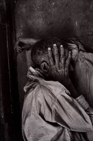 India (Man with hand over face)