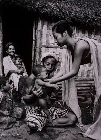 1968, Bali (Woman lifting child)

