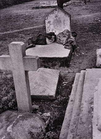 Lagos, Nigeria (Two people sleeping on gravestone)