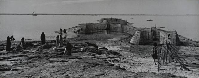 People and Huts by Water, Kuwait