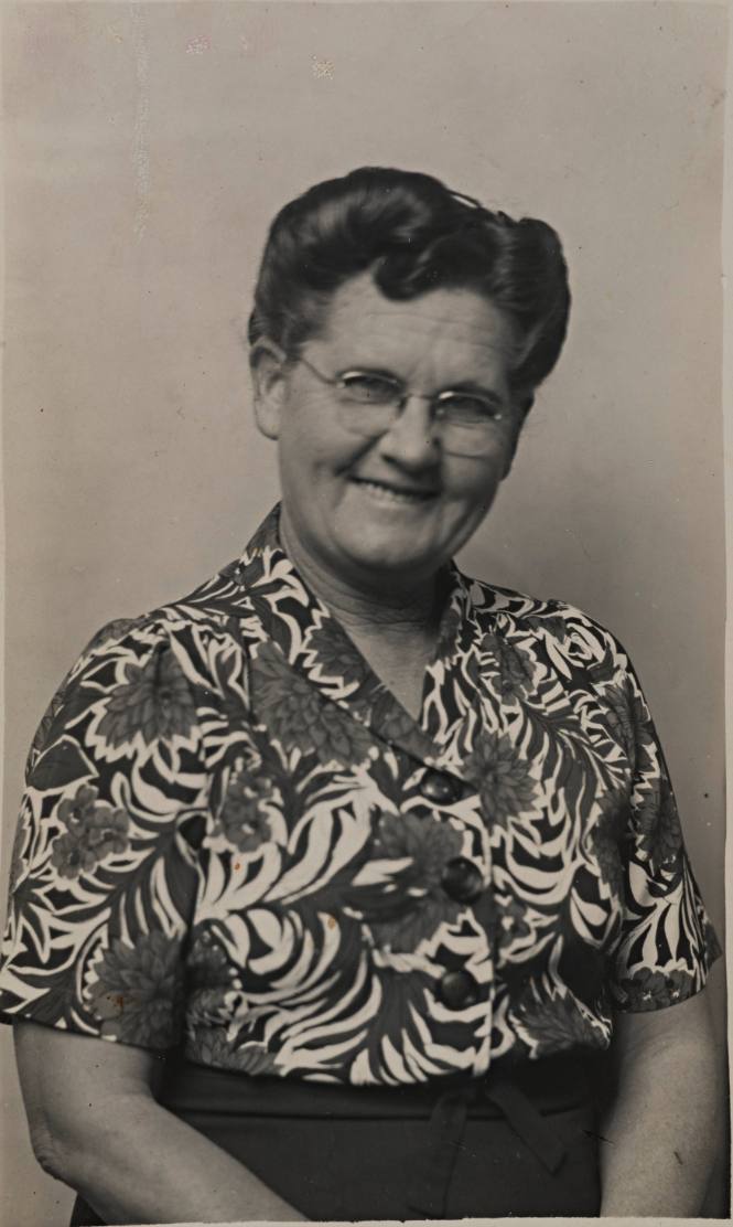 Smiling Middle-aged Woman with Brightly-patterned Blouse