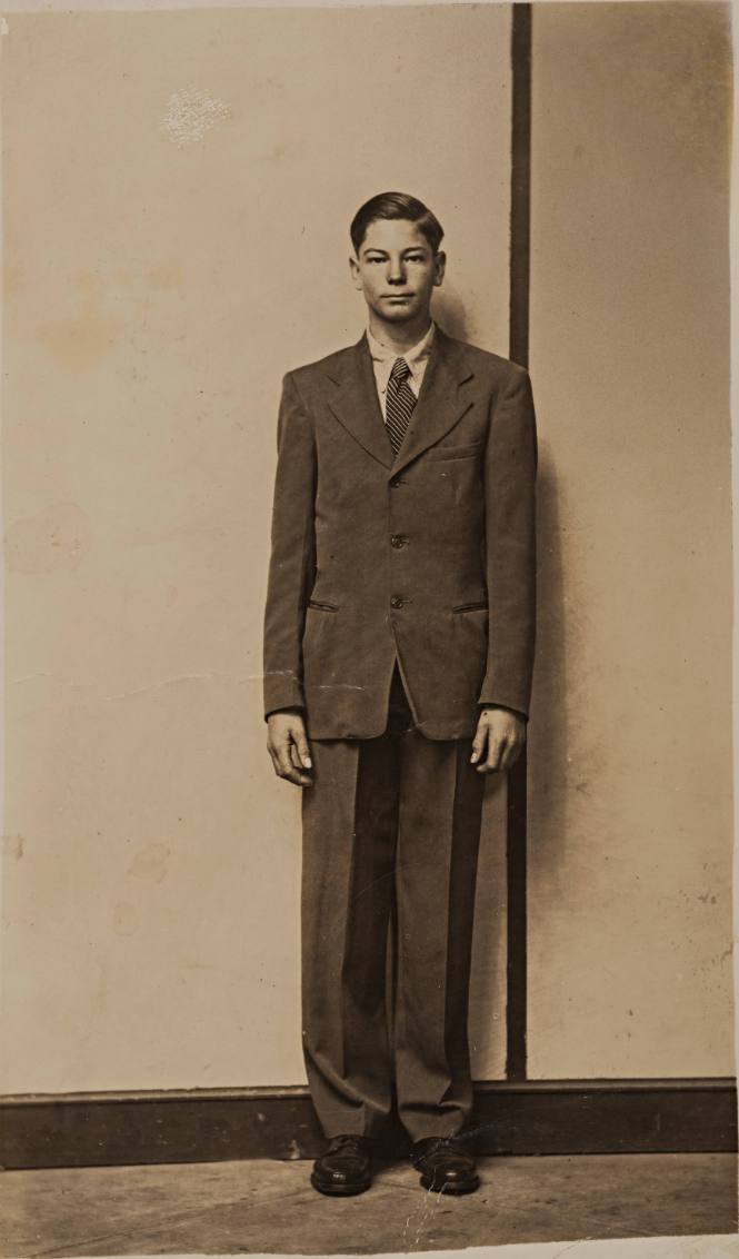 Standing Formally-dressed Young Man, Striped Backgorund