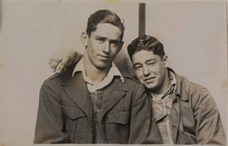 Two Young Men Embracing, Striped Background