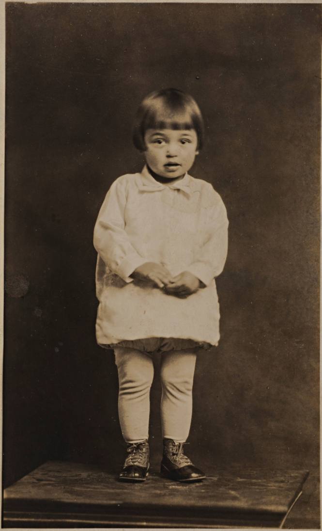 Infant Girl Standing on Table
