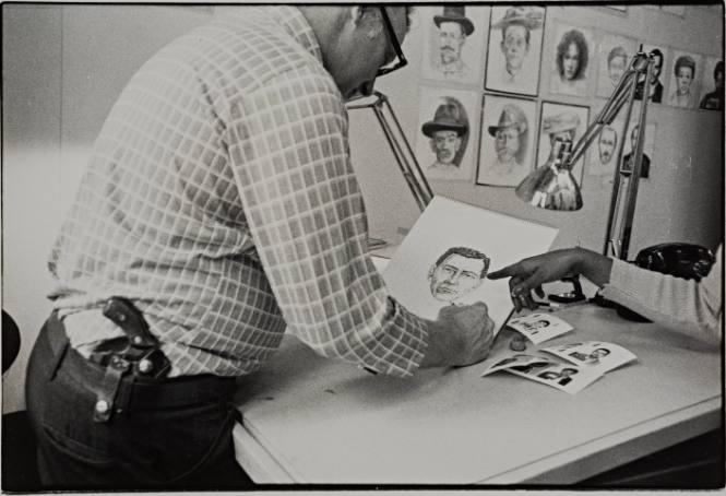 Police Artist Makes Drawing with the Witness Pointing Out Detail, Police Headquarters, New York City.