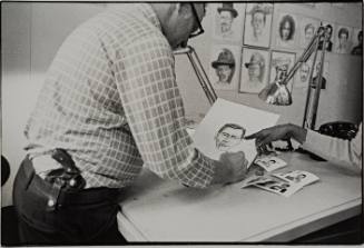 Police Artist Makes Drawing with the Witness Pointing Out Detail, Police Headquarters, New York City.