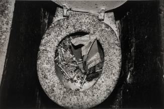 "Shooting gallery" lavatory clogged with gelatine capsules and syringes