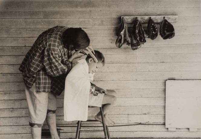 Mother Cutting Her Son's Hair