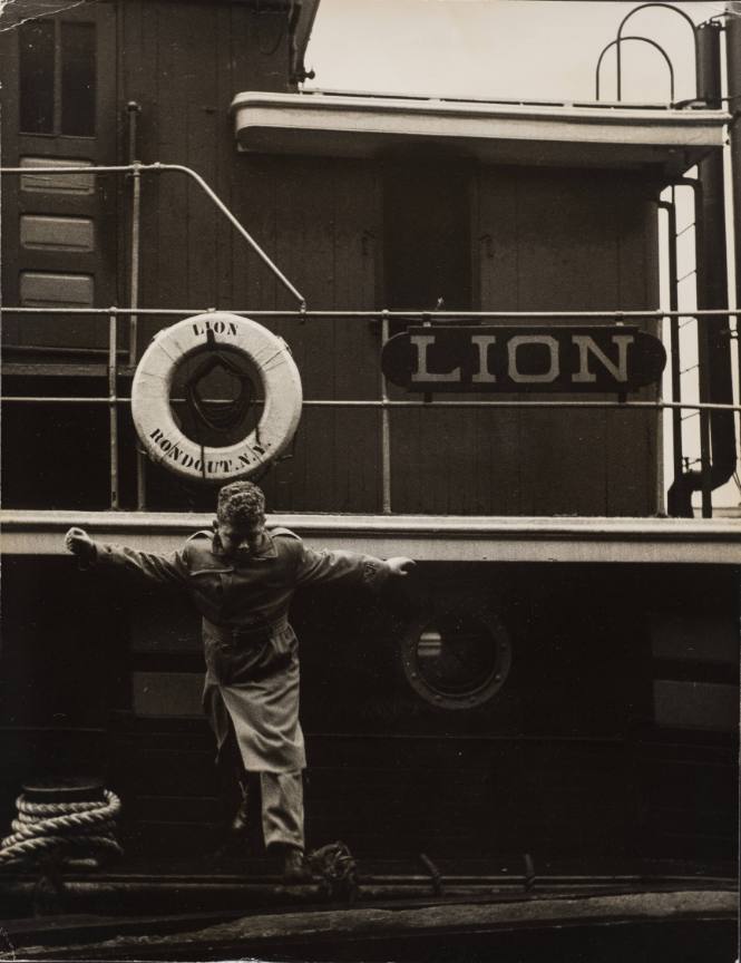 NYC Boy Standing in Front of the Lion, a Ship from Rondout, N.Y.