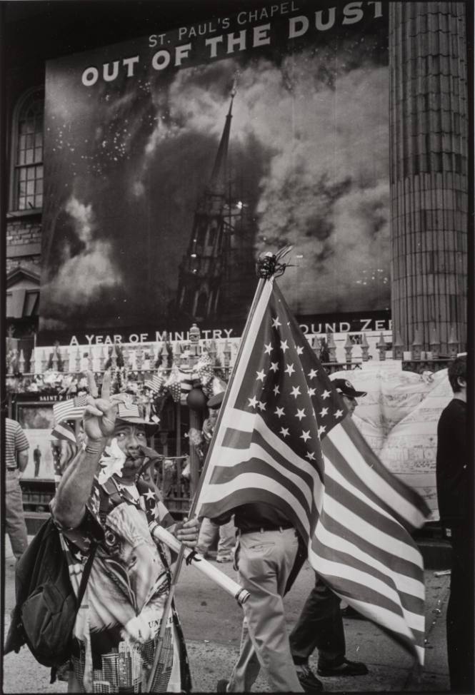 Man with Flag Walking Past St. Paul's Chapel, New York City, USA