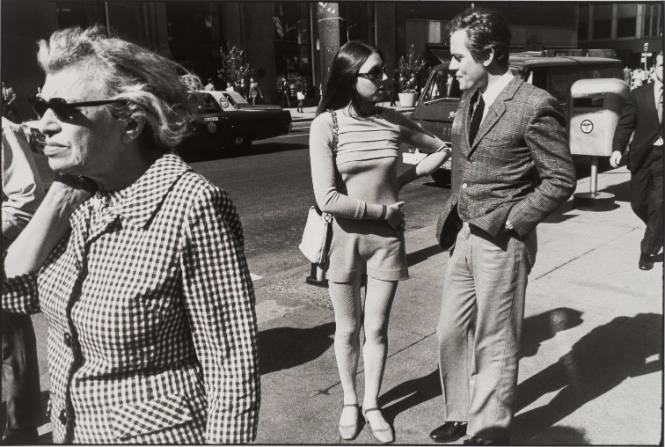 Untitled, from Women are Beautiful [Young Couple Passed by an Older Woman in Sun Glasses]